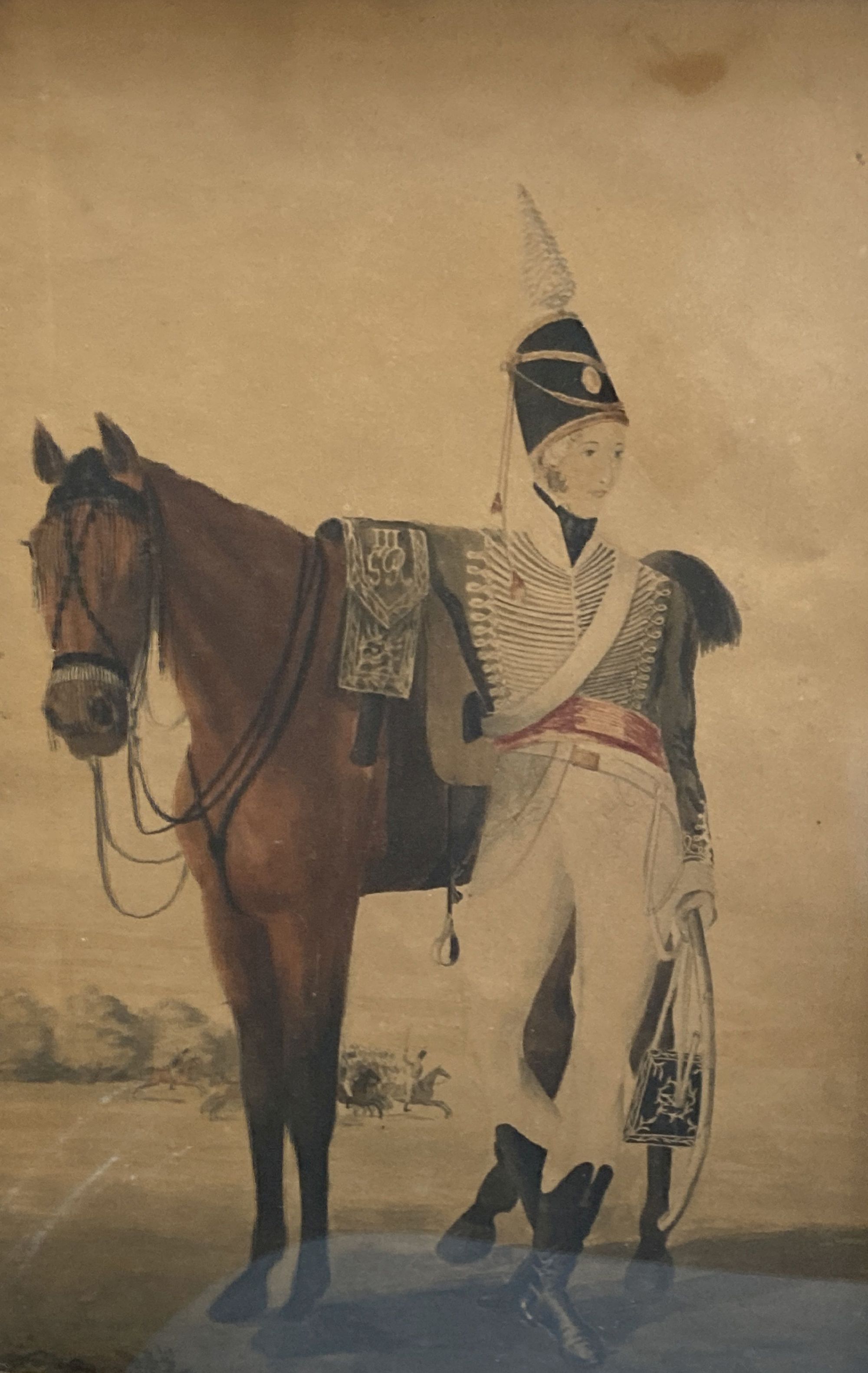 English School c.1800, watercolour, Portrait of a Hussar standing beside his horse, with George III cypher on the saddle, 41 x 27cm and